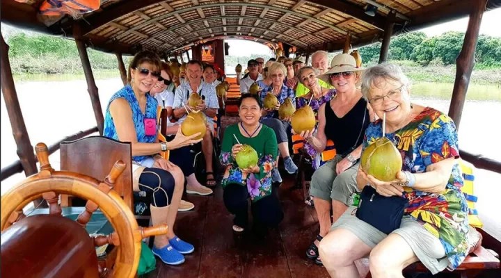 Tourists take a motorboat to Tam Hiep Island