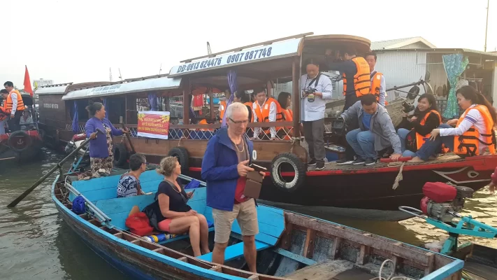 Boat carrying passengers to the floating market