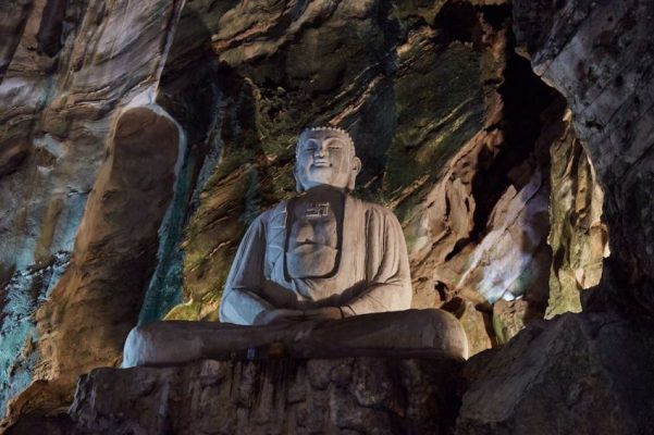 Exquisite Buddha statue inside Huyen Khong Cave