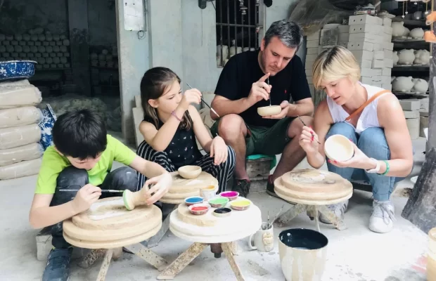 Children learn how to make traditional pottery.