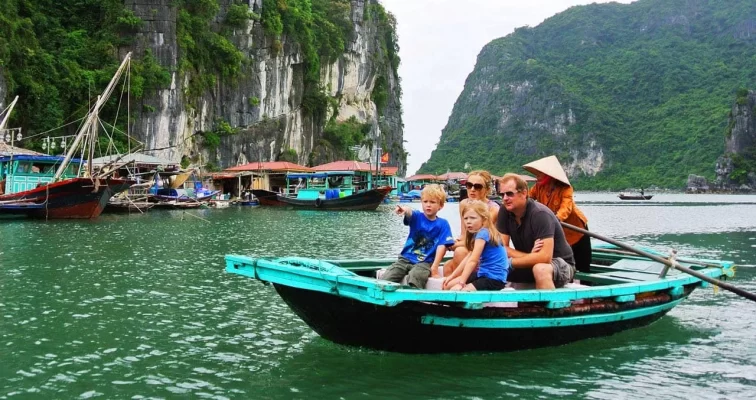 Family visits fishing village in Halong Bay