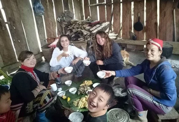 Tourists experience cuisine with locals.