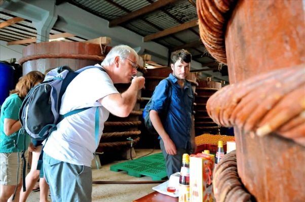 Tourists visit fish sauce factory in Phu Quoc.