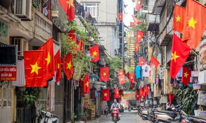 Vietnamese people often hang the national flag on Reunification Day.